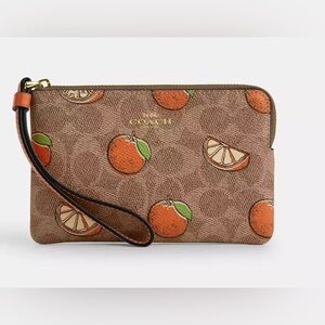 New Corner Zip Wristlet In Signature Canvas